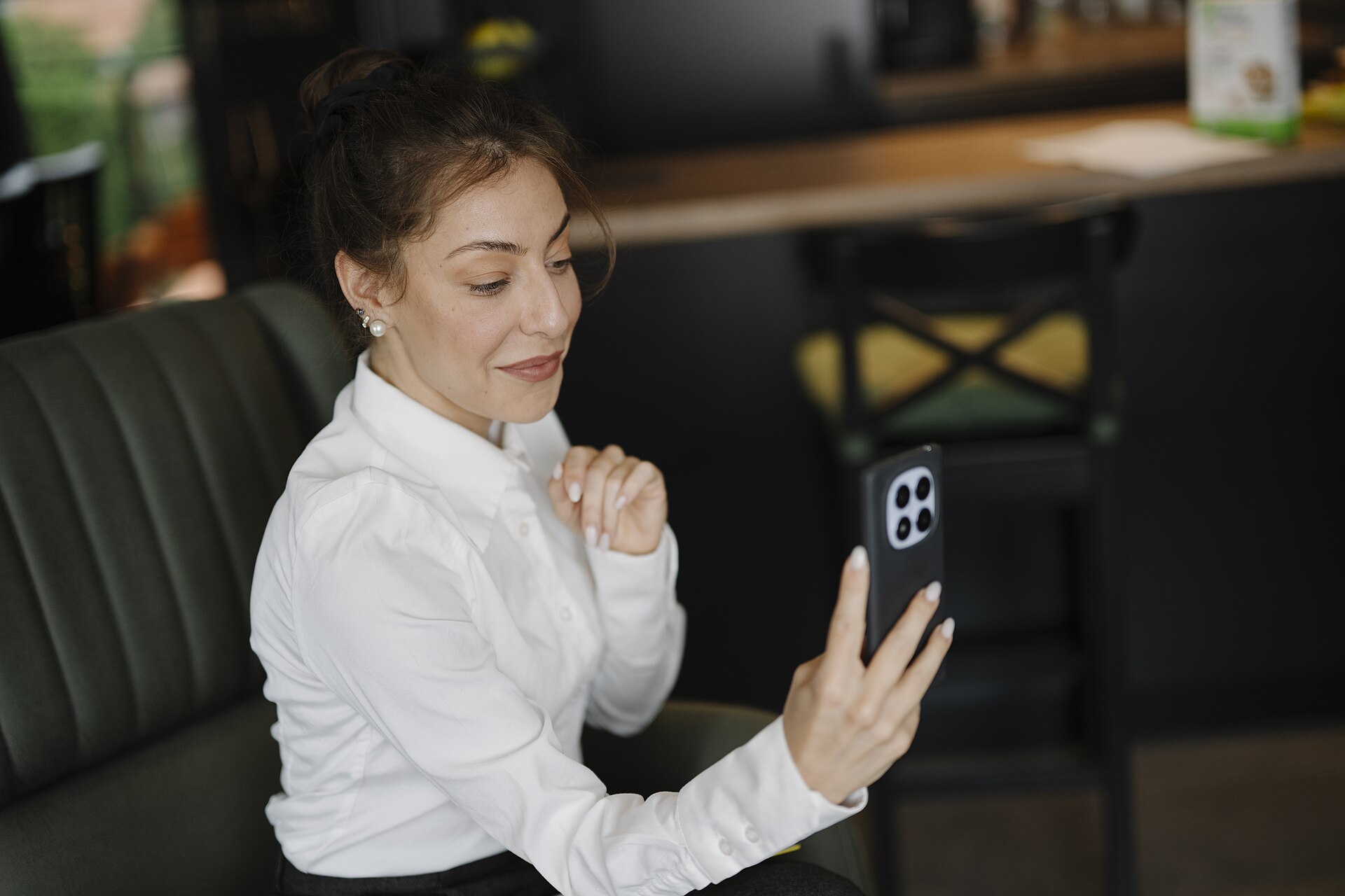 A woman smiling during a video call